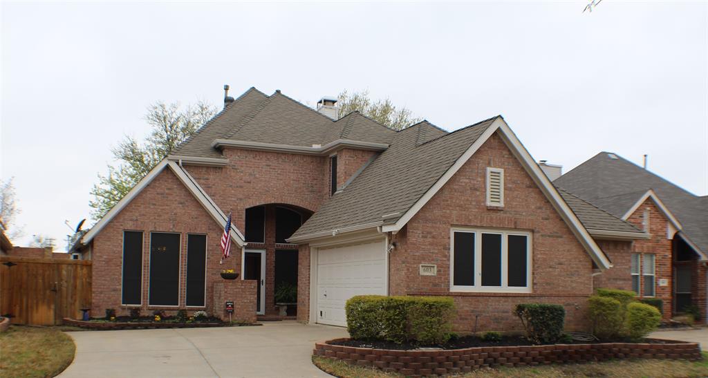 a front view of a house with garage