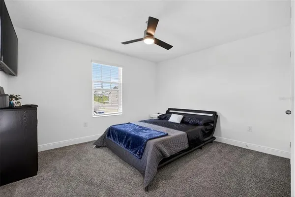 a room that has a bed and a chair in it