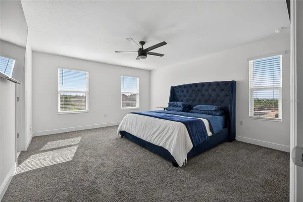 a view of a livingroom with furniture and white walls