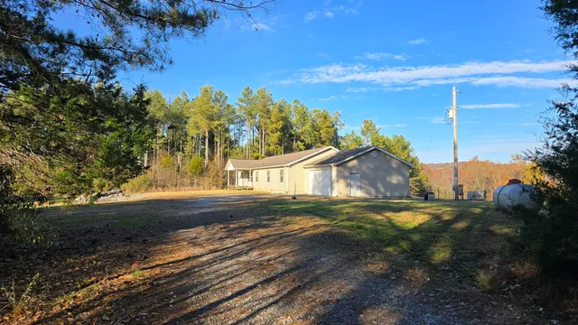 a bedroom with a large bed and a dresser