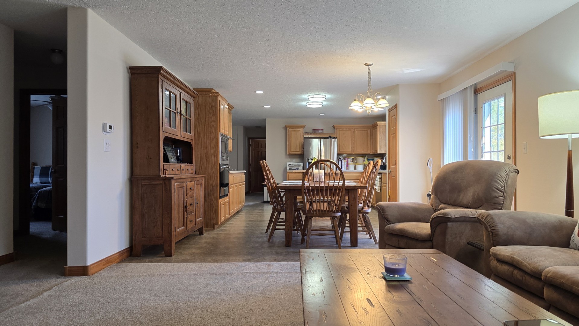 1240 Hummingbird Road Buncombe, IL 62912 - Photo 18 of 51 a living room with furniture dining and a chandelier