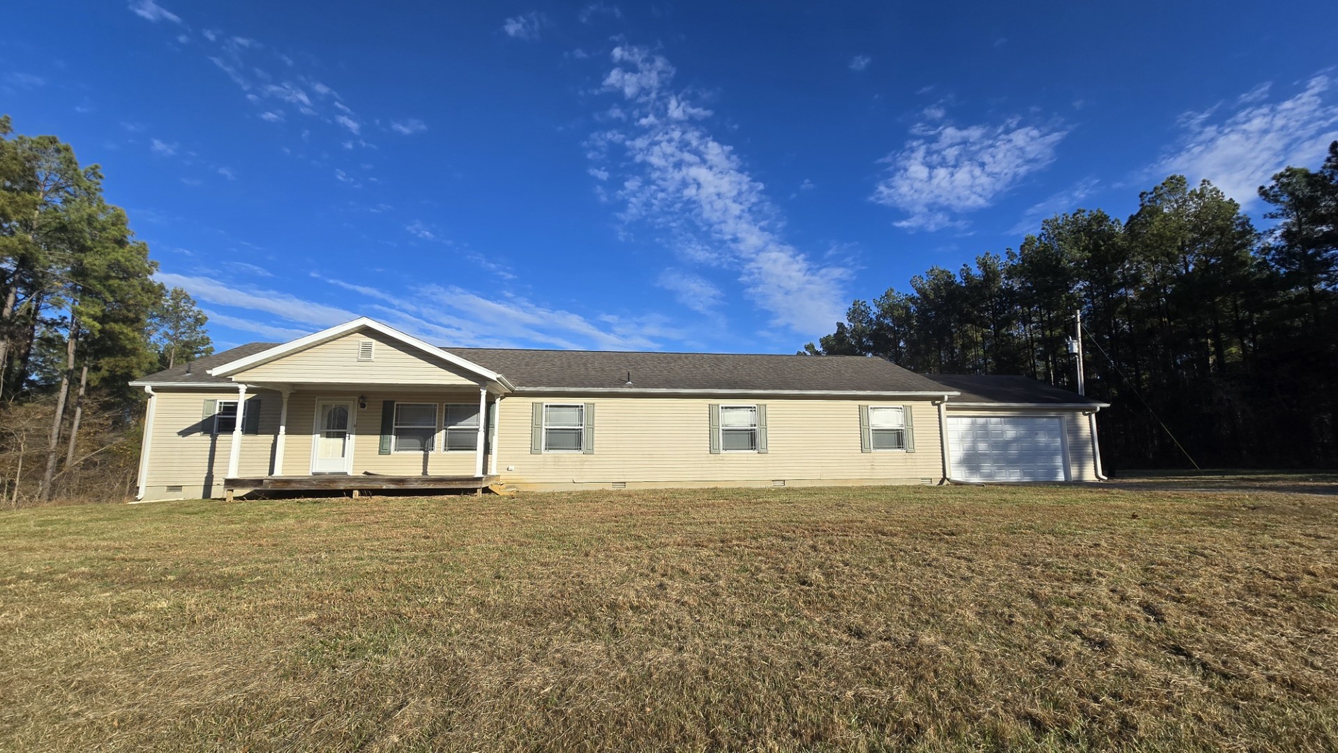 1240 Hummingbird Road Buncombe, IL 62912 - Photo 22 of 51 a front view of a house with a yard