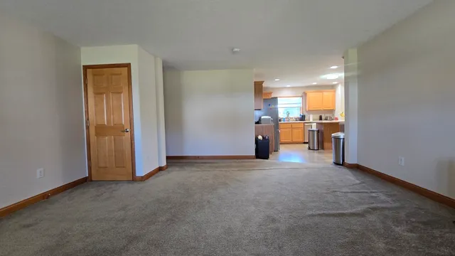 a kitchen with stainless steel appliances a sink stove and cabinets