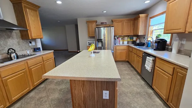 a bedroom with bed and a chandelier