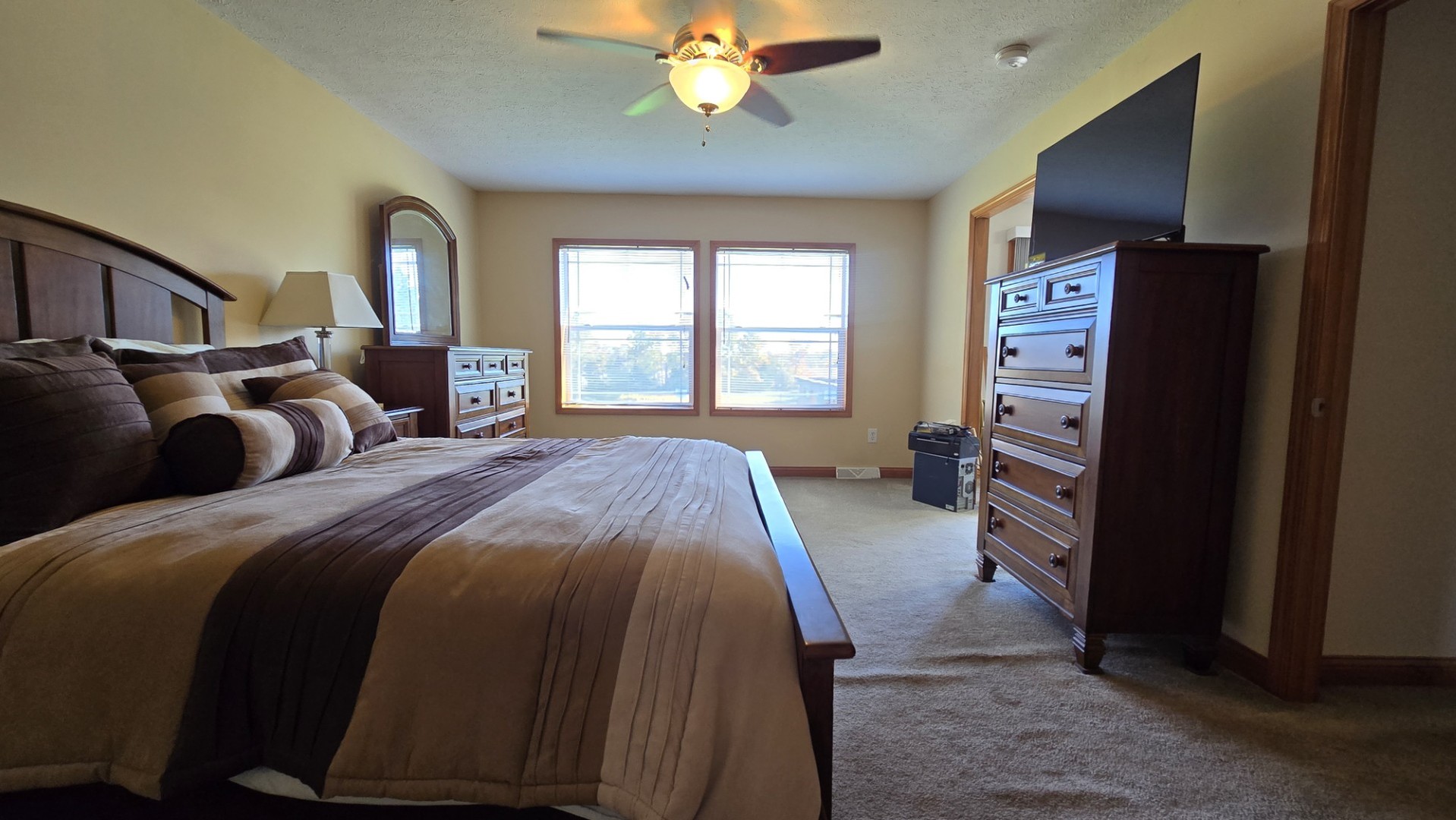 1240 Hummingbird Road Buncombe, IL 62912 - Photo 36 of 51 a spacious bedroom with a bed and a chandelier