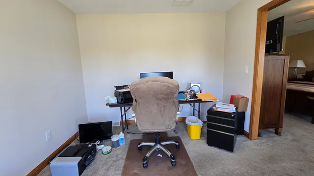a view of a door and wooden floor