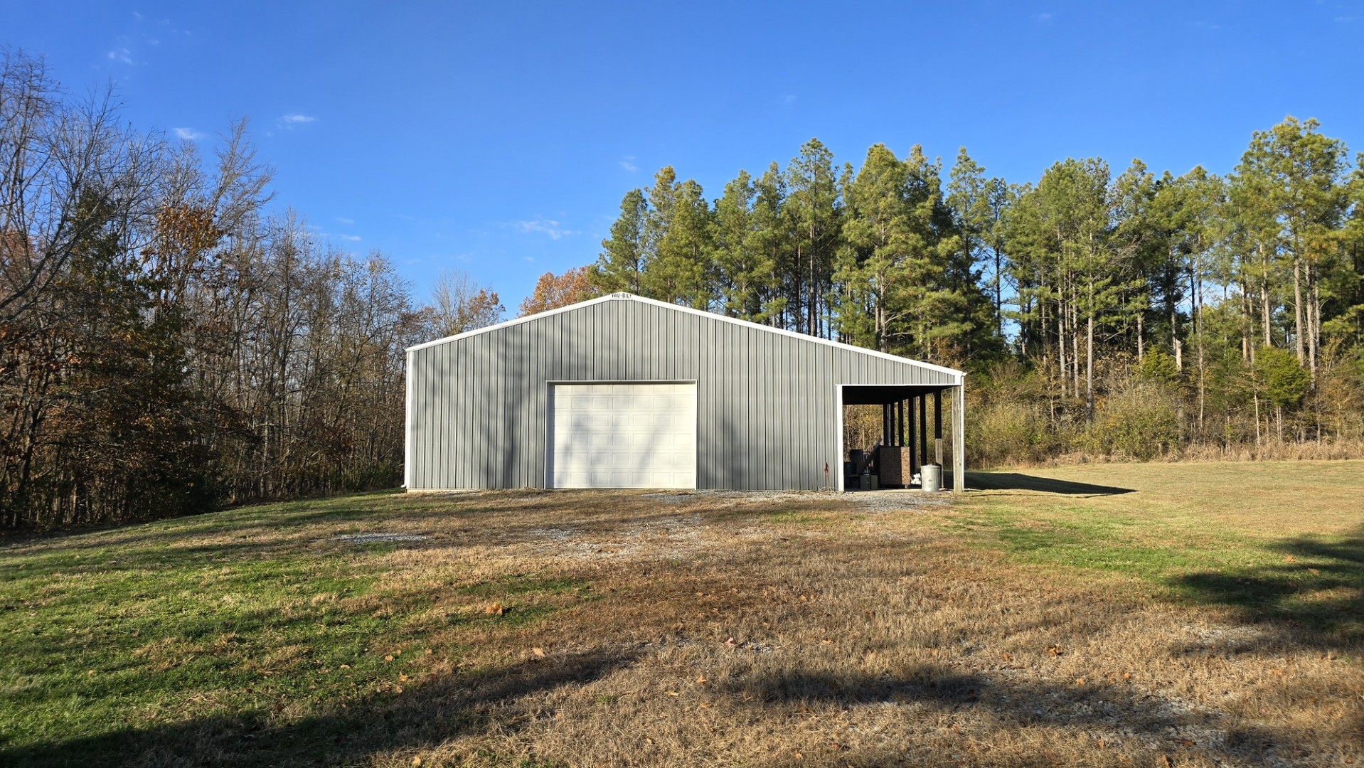 1240 Hummingbird Road Buncombe, IL 62912 - Photo 7 of 51 a house with trees in the background