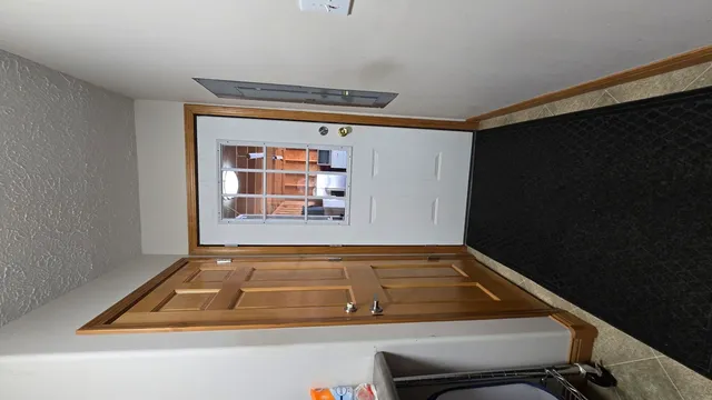 a bed room with a bed and a television