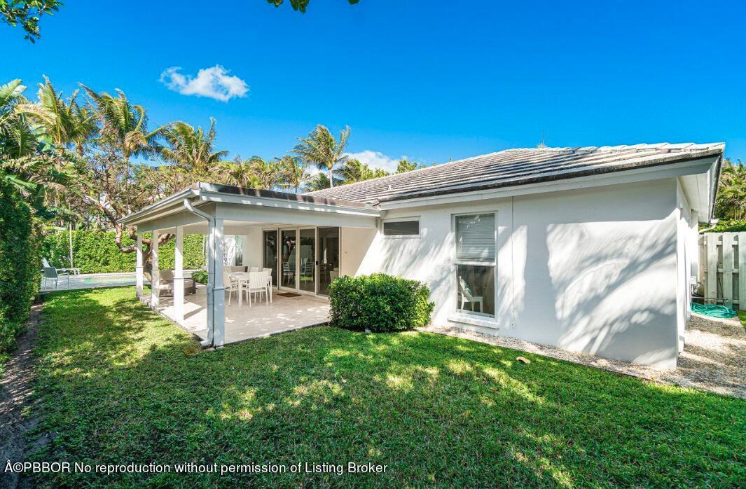 110 Seagate Road Palm Beach, FL 33480 - Photo 16 of 19 a front view of a house with patio and garden