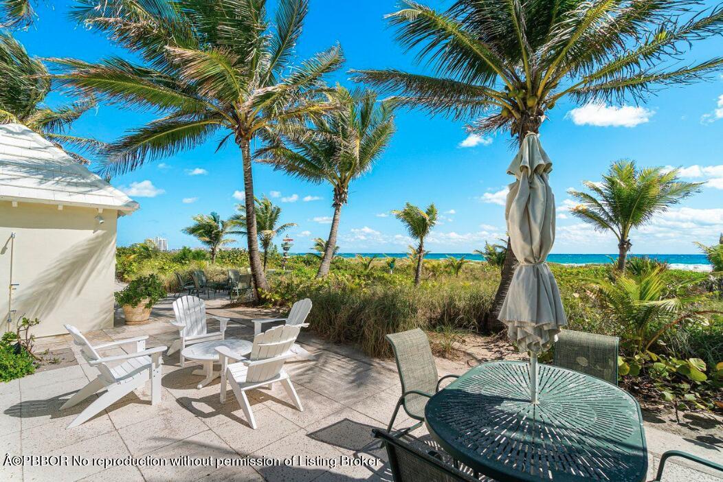 110 Seagate Road Palm Beach, FL 33480 - Photo 19 of 19 a view of a backyard with plants and a patio