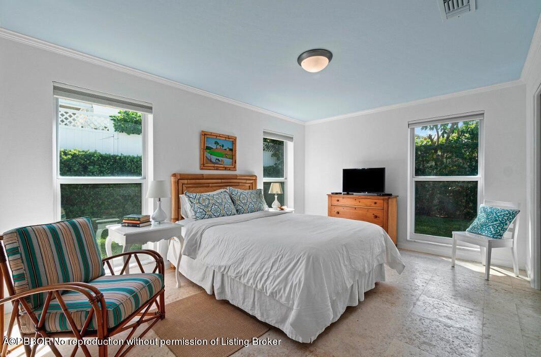 110 Seagate Road Palm Beach, FL 33480 - Photo 3 of 19 a bedroom with a bed and a view of balcony