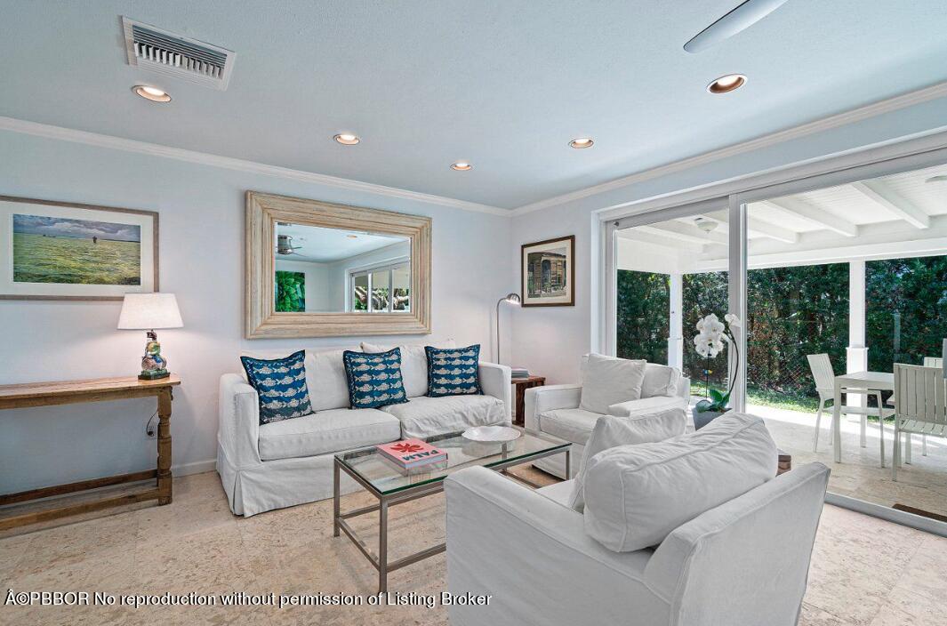 110 Seagate Road Palm Beach, FL 33480 - Photo 7 of 19 a living room with furniture and a large window