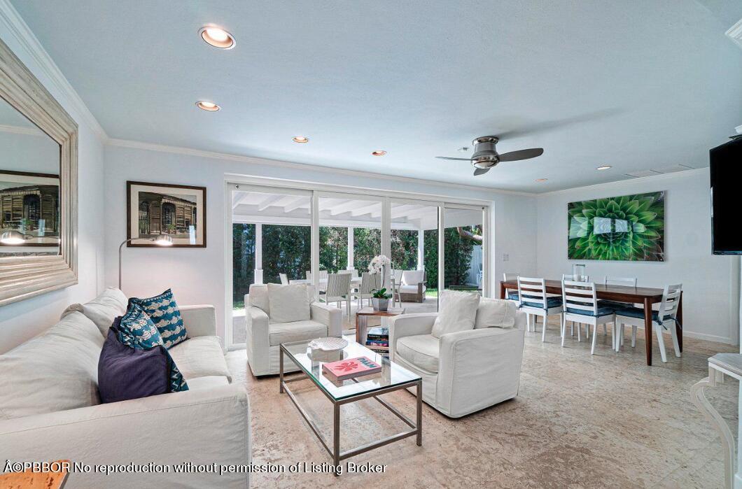 110 Seagate Road Palm Beach, FL 33480 - Photo 8 of 19 a living room with furniture and a large window