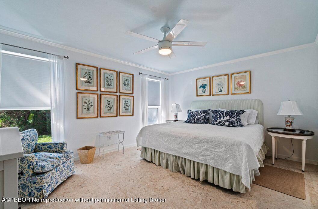 110 Seagate Road Palm Beach, FL 33480 - Photo 10 of 19 a bedroom with a bed and ceiling fan