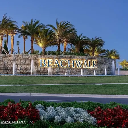 a sign that is in front of flowers