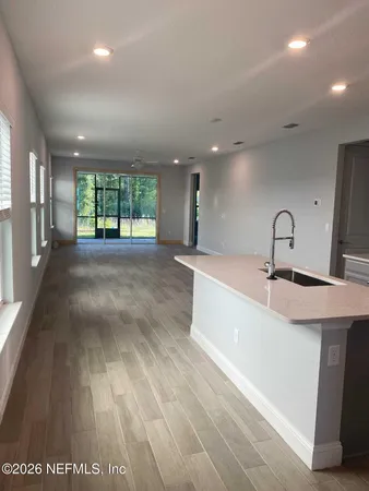 a large room with lots of counter space and windows