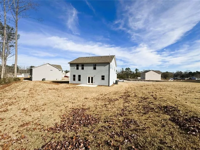 a view of large house with a yard