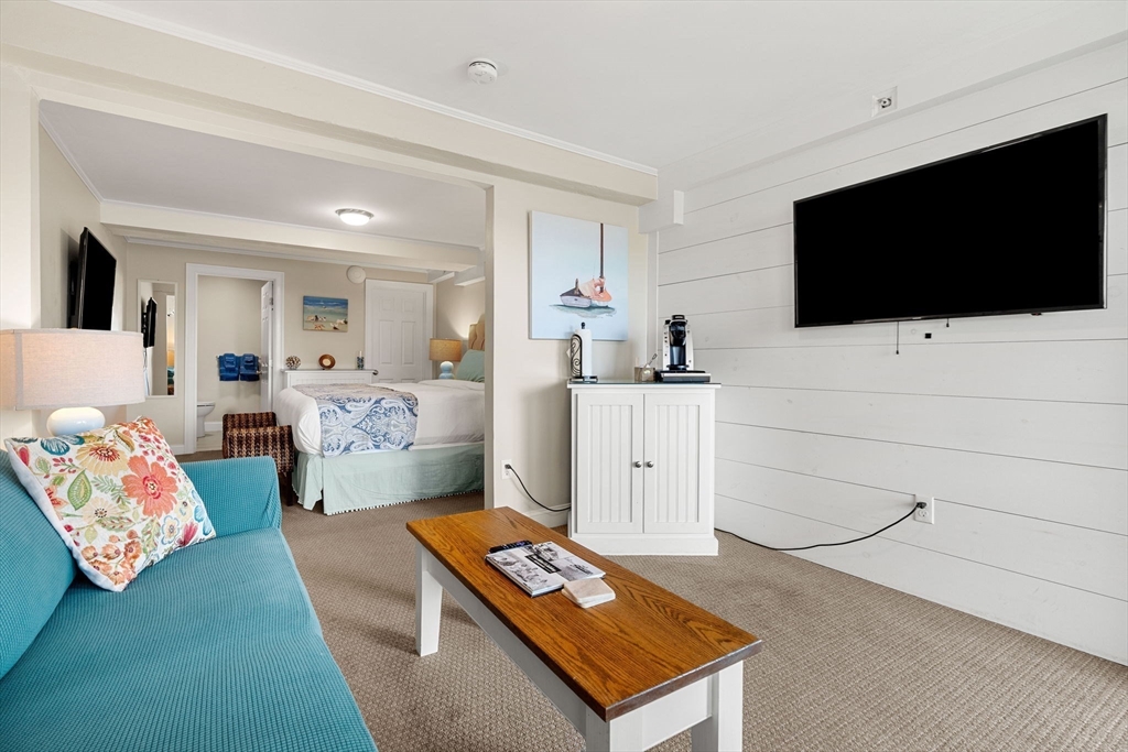 175 Bridge Road Salisbury, MA 01952 - Photo 24 of 42 a living room with furniture and a flat screen tv