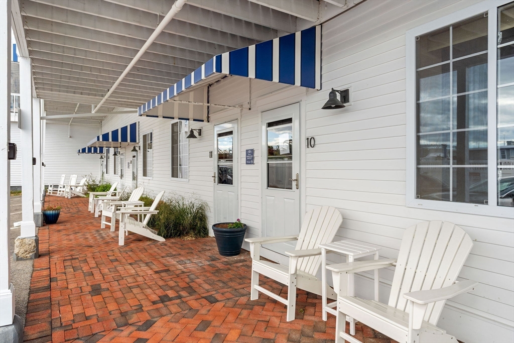 175 Bridge Road Salisbury, MA 01952 - Photo 26 of 42 a view of a patio with table and chairs and potted plants