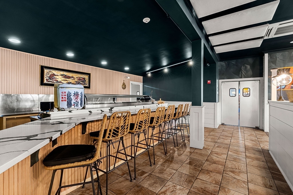175 Bridge Road Salisbury, MA 01952 - Photo 38 of 42 a kitchen with stainless steel appliances kitchen island granite countertop a sink and cabinets