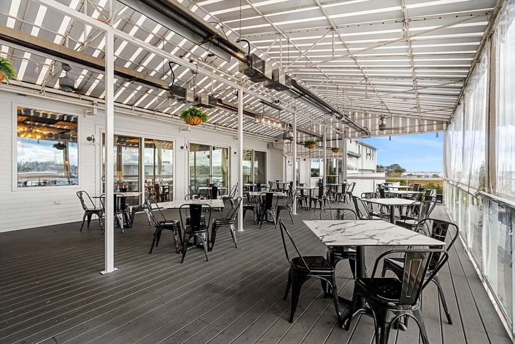 175 Bridge Road Salisbury, MA 01952 - Photo 39 of 42 a view of a dining room with furniture window and wooden floor