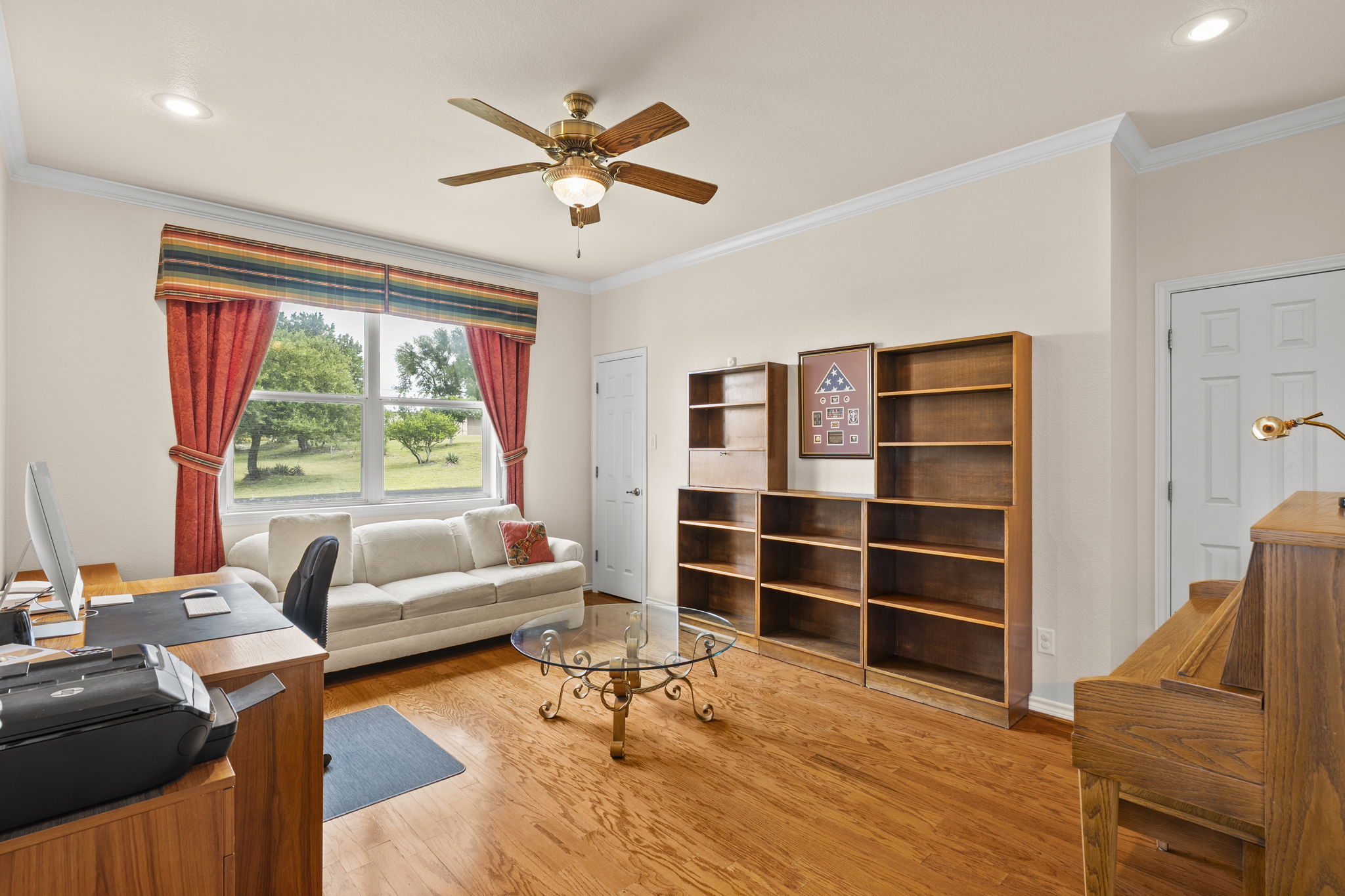 1427 River Ridge Ranch Road Killeen, TX 76549 - Photo 11 of 40 A versatile flex room for office space, formal dining, or a 5th bedroom featuring a closet, hardwood flooring, and a large window offering outdoor views.
