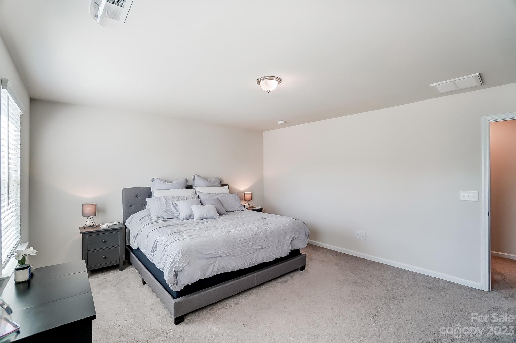 1712 Loggerhead Drive Lancaster, SC 29720 - Photo 17 of 43 a bedroom with a bed and a night stand