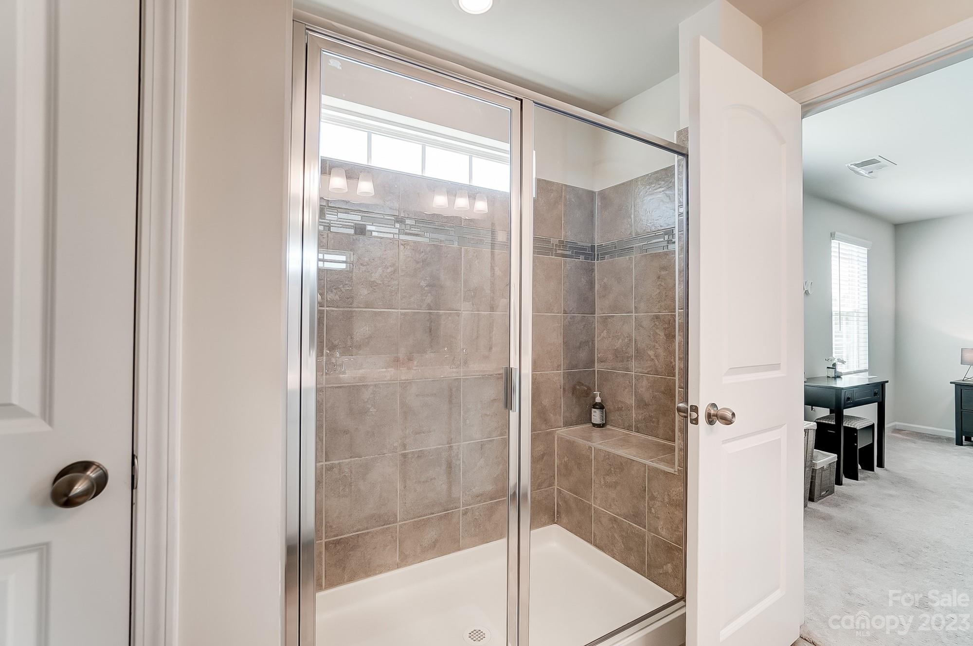 1712 Loggerhead Drive Lancaster, SC 29720 - Photo 20 of 43 a bathroom with a glass shower door
