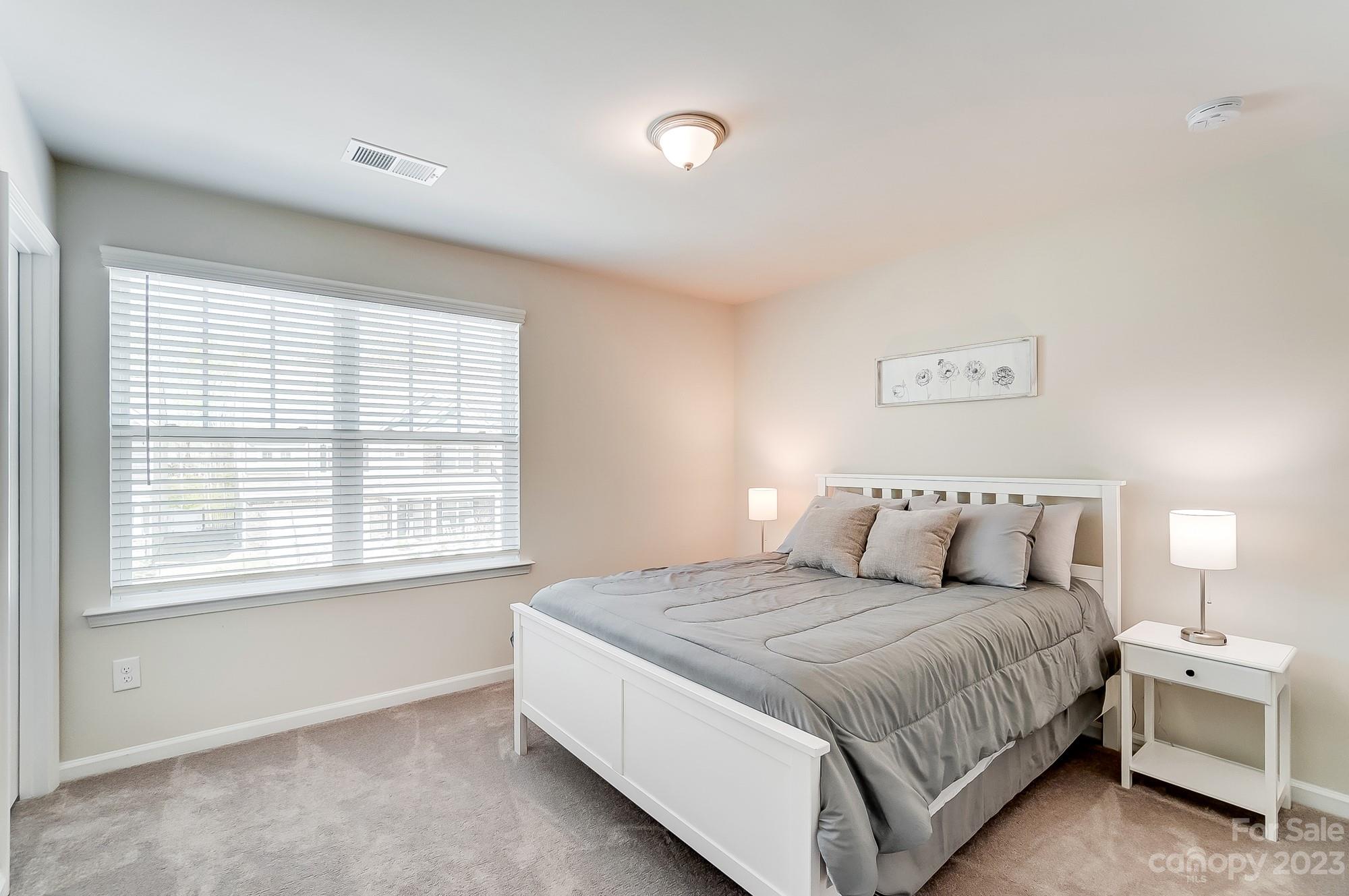 1712 Loggerhead Drive Lancaster, SC 29720 - Photo 22 of 43 a large bed sitting in a bedroom next to a window