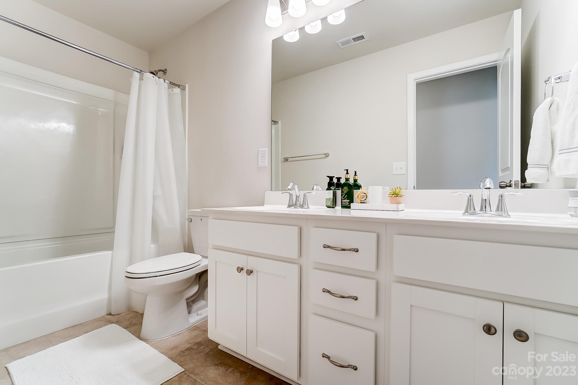 1712 Loggerhead Drive Lancaster, SC 29720 - Photo 27 of 43 a bathroom with a sink toilet and shower