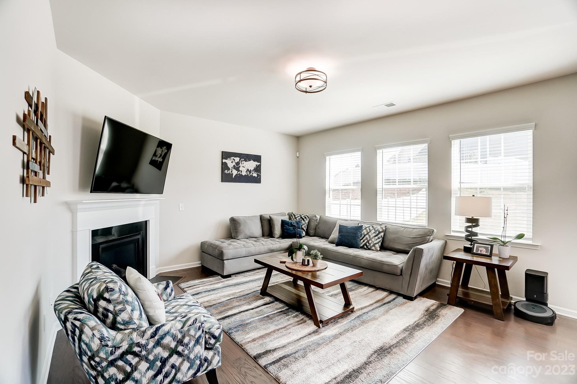 1712 Loggerhead Drive Lancaster, SC 29720 - Photo 3 of 43 a living room with furniture a fireplace and a flat screen tv