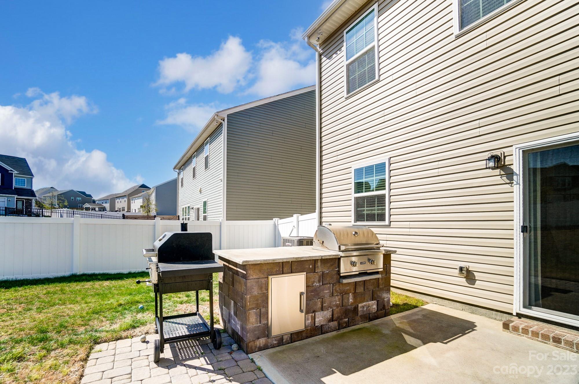 1712 Loggerhead Drive Lancaster, SC 29720 - Photo 35 of 43 a patio with table and chairs and potted plants