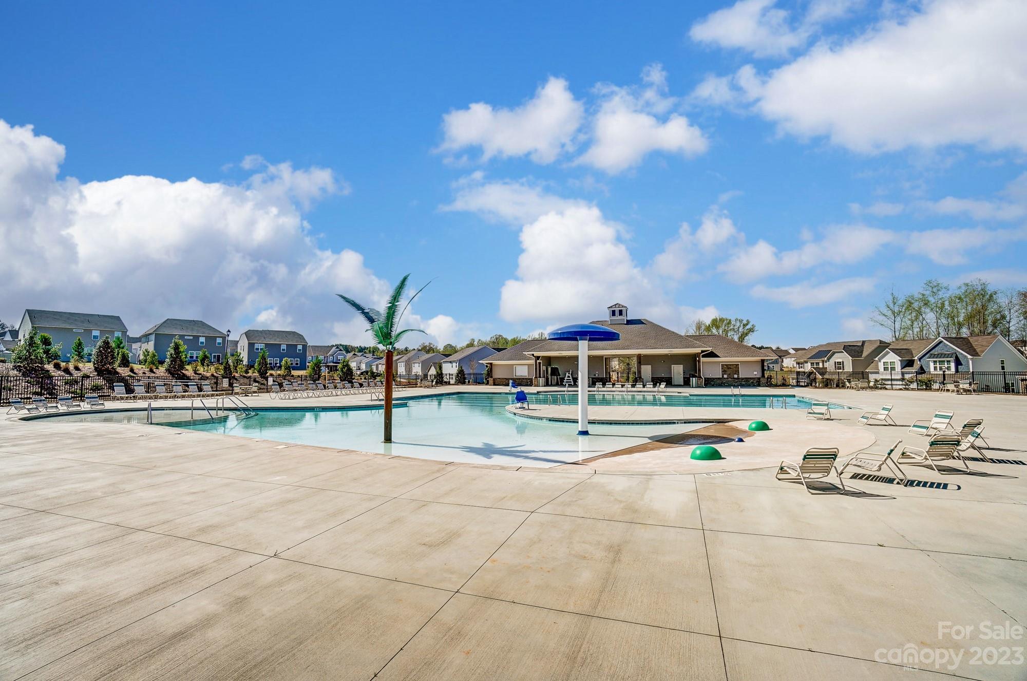 1712 Loggerhead Drive Lancaster, SC 29720 - Photo 37 of 43 a view of swimming pool with outdoor seating and a lots of trees in the background
