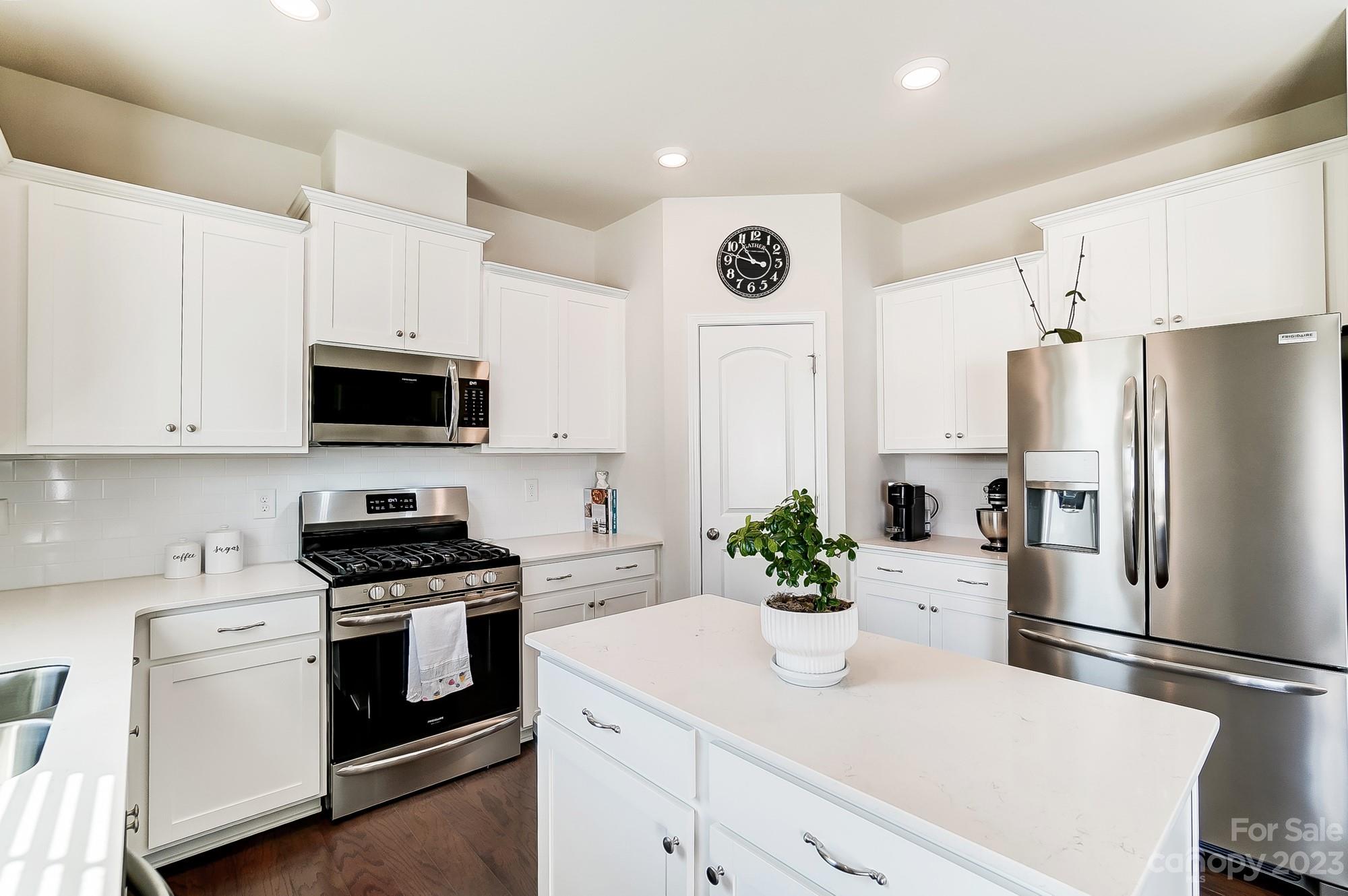 1712 Loggerhead Drive Lancaster, SC 29720 - Photo 7 of 43 a kitchen with white cabinets stainless steel appliances and white cabinets