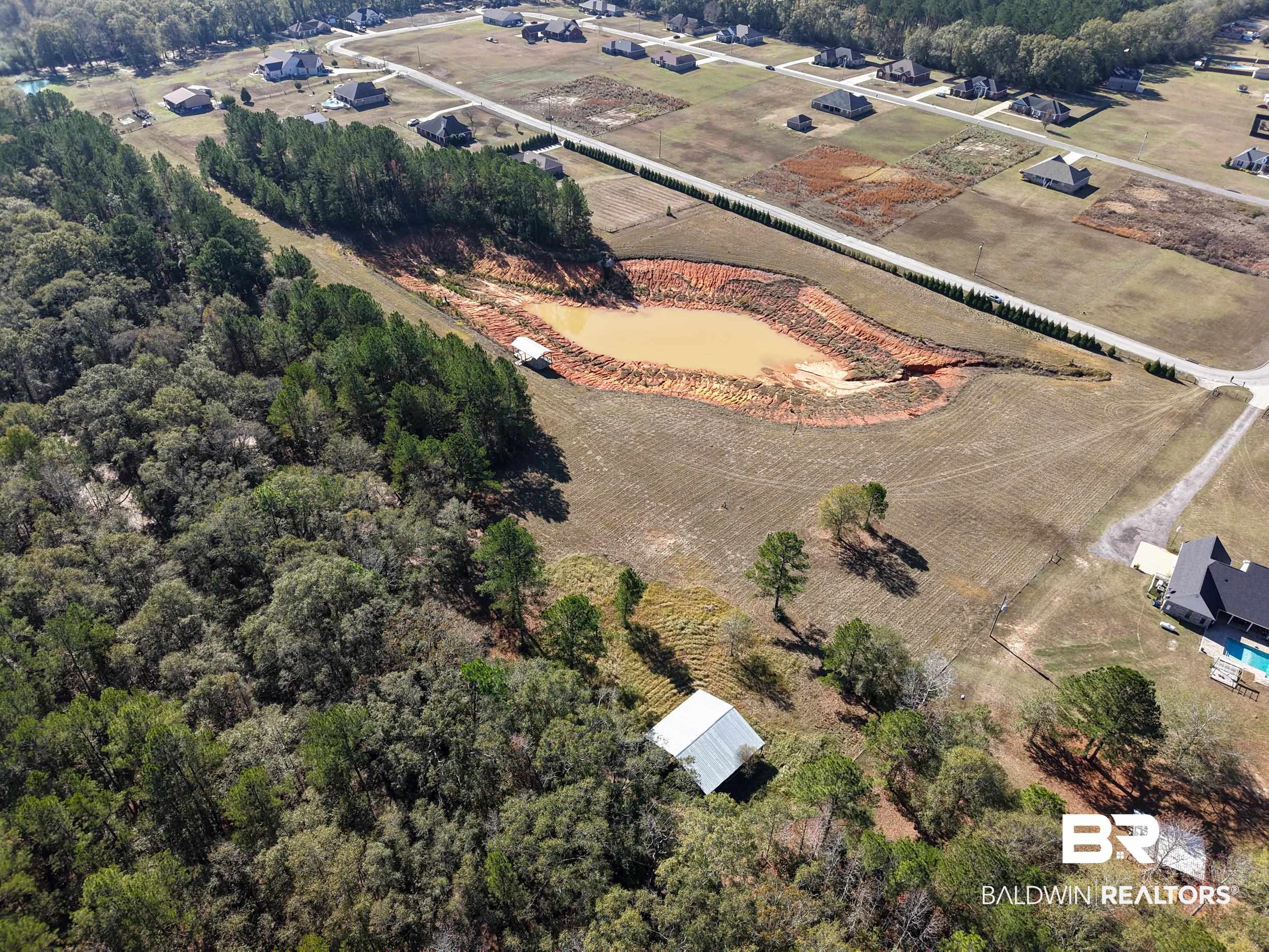 0 Stokley Court Atmore, AL 36502 - Photo 7 of 22 Aerial view of property and surrounding area featuring rural landscape