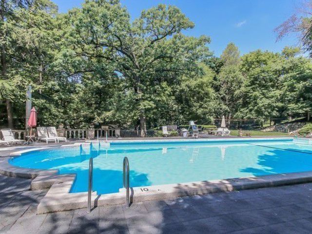 20 Marryat Road Trout Valley, IL 60013 - Photo 23 of 33 a view of a swimming pool with an outdoor space and seating area