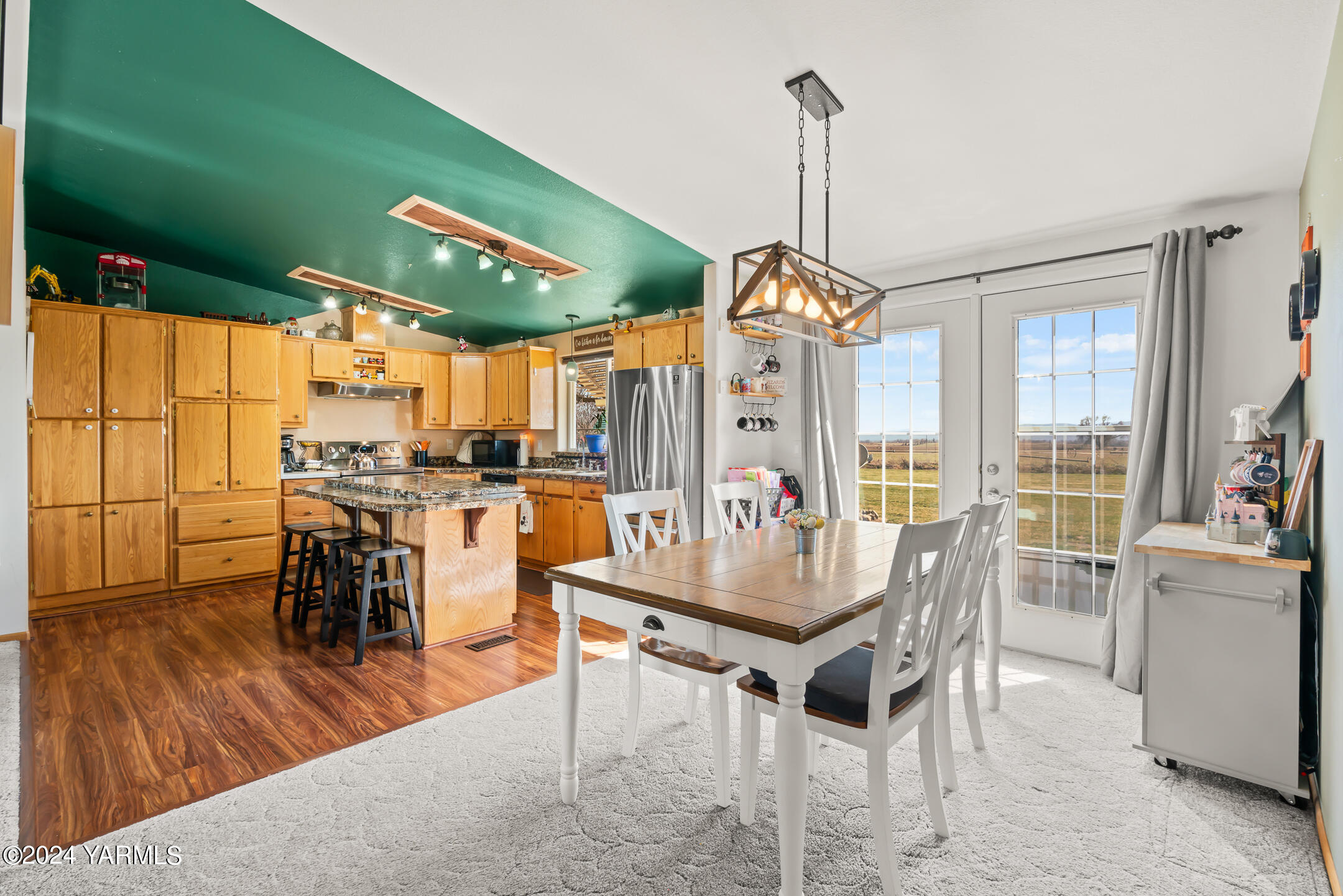 270 Hinman Road Harrah, WA 98933 - Photo 12 of 36 a dining room with furniture window wooden floor