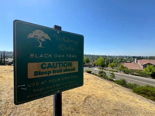 a sign on the side of the road