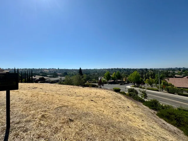 a view of swimming pool with lawn chairs