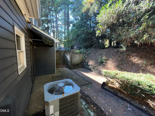 a view of a backyard with table and chairs and a fire pit