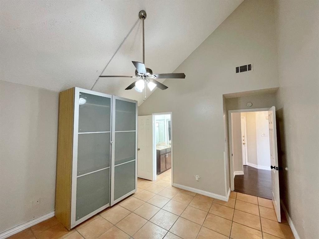 3147 Royal Gable Drive Dallas, TX 75229 - Photo 11 of 22 a view of an empty room with window and chandelier fan