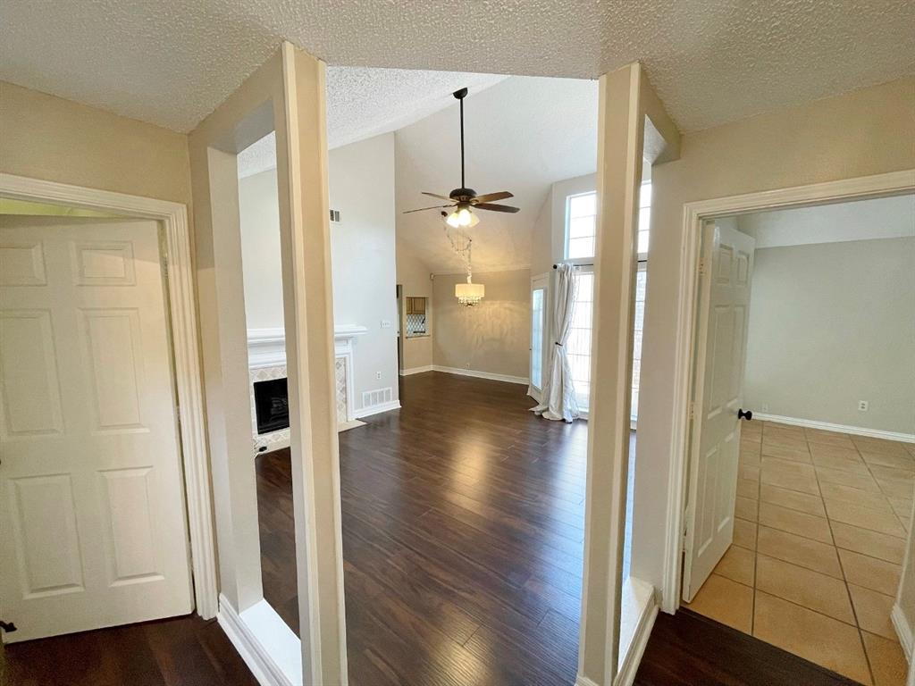 3147 Royal Gable Drive Dallas, TX 75229 - Photo 3 of 22 a view of a hallway with wooden floor