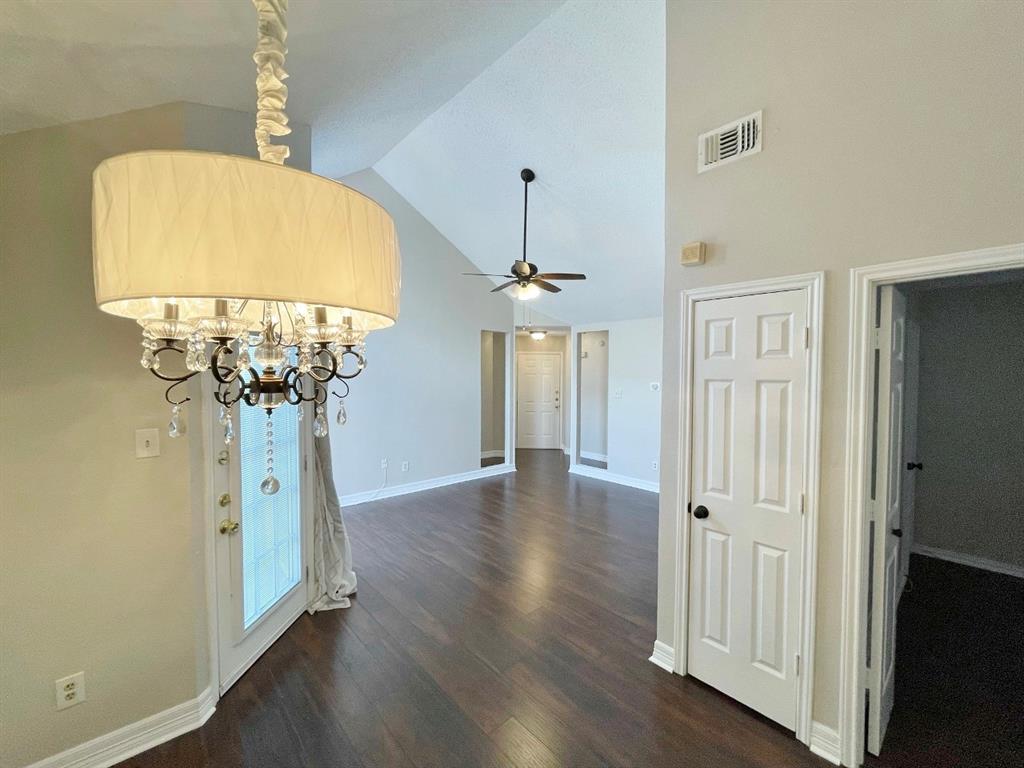3147 Royal Gable Drive Dallas, TX 75229 - Photo 6 of 22 wooden floor in an empty room with a window