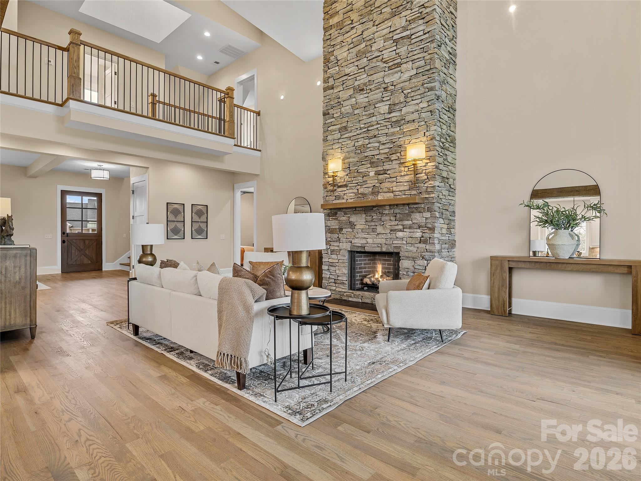 297 Mountain Meadows Lane, Unit 7 Tryon, NC 28782 - Photo 8 of 47 a living room with furniture a fireplace and a flat screen tv