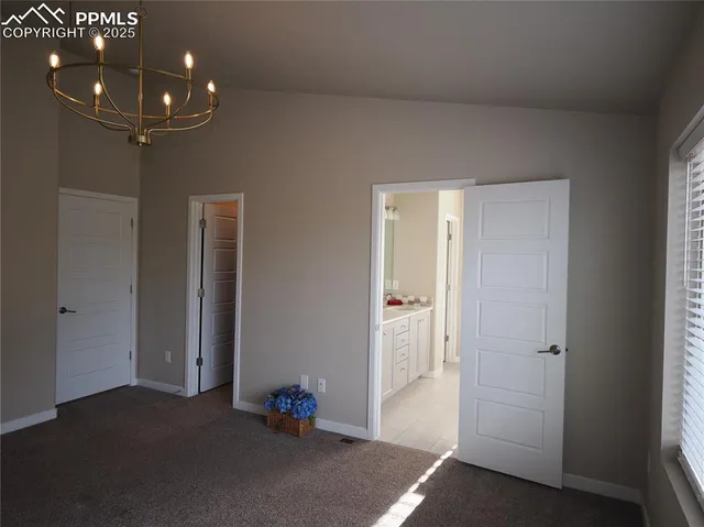 a view of livingroom with furniture and chandelier fan