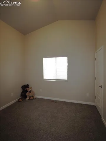 a room with a bed and a window