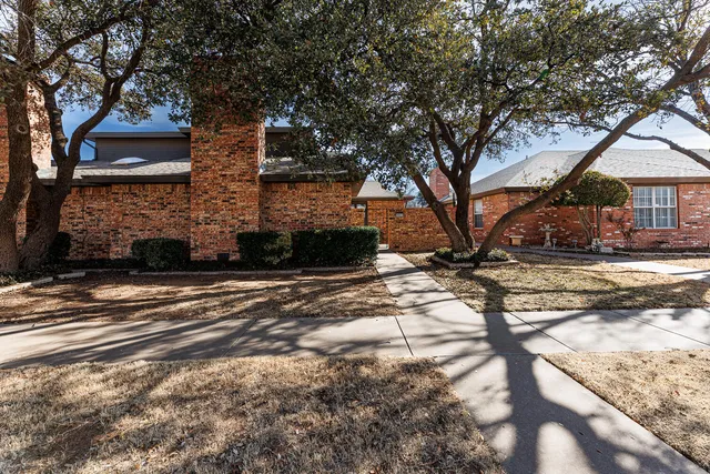 a view of empty room with a fireplace