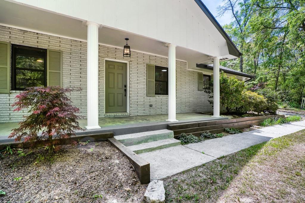 2021 Irwin Bridge Road Northwest Conyers, GA 30012 - Photo 6 of 43 a front view of a house with garden