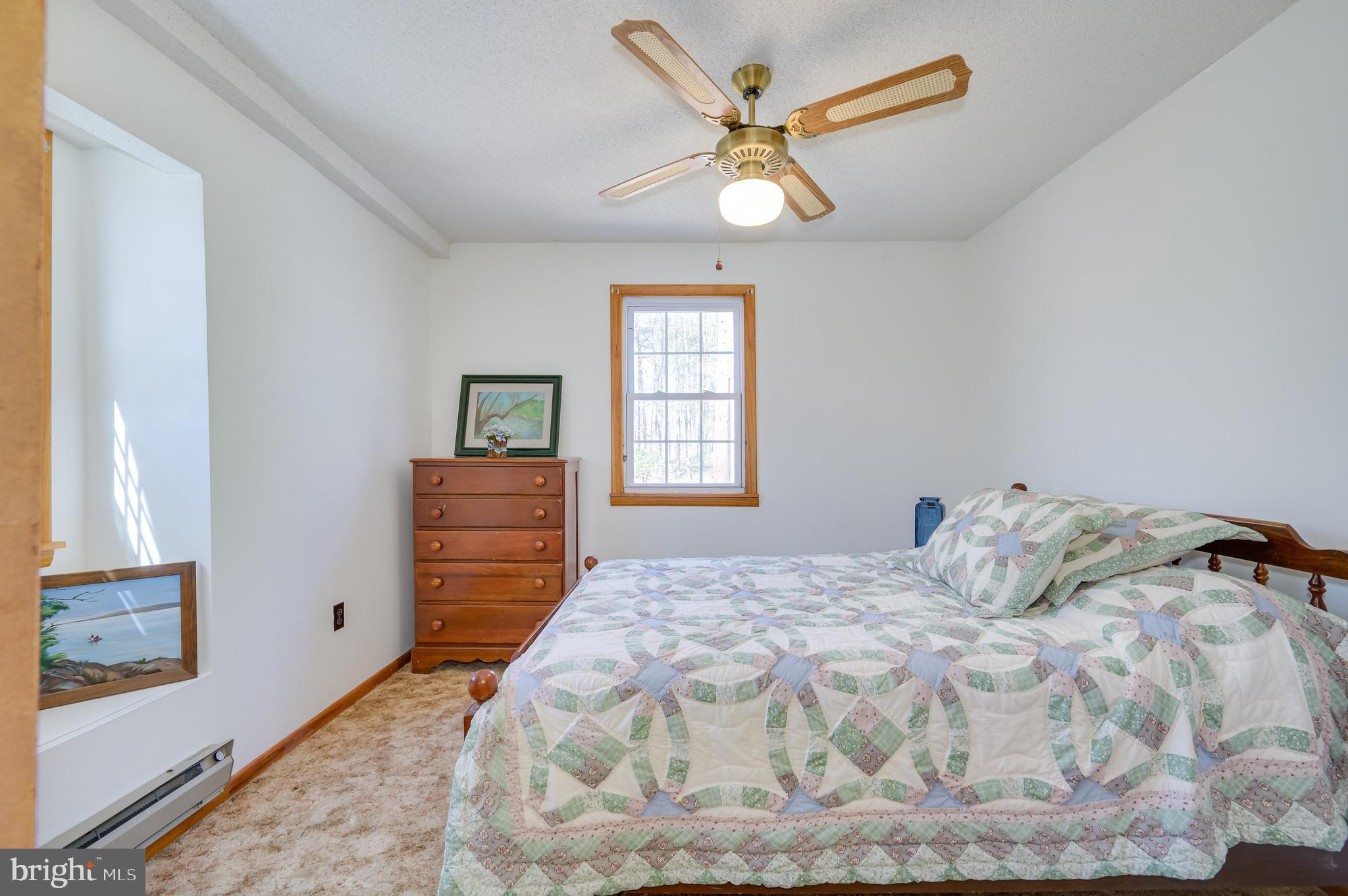 1524 Lamplight Road Bunker Hill, WV 25413 - Photo 16 of 44 a bedroom with a bed and a window