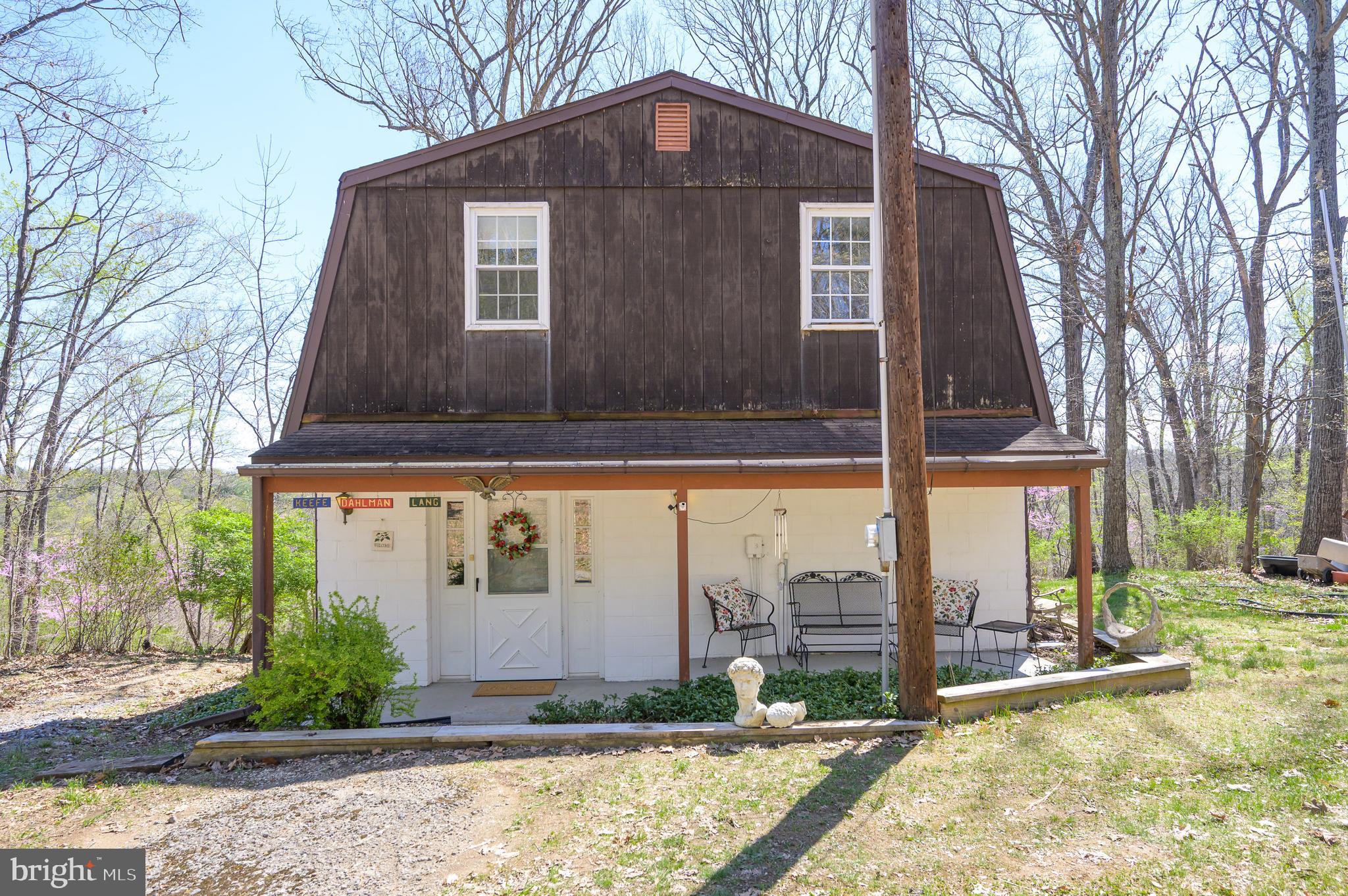 1524 Lamplight Road Bunker Hill, WV 25413 - Photo 2 of 44 a front view of house with yard